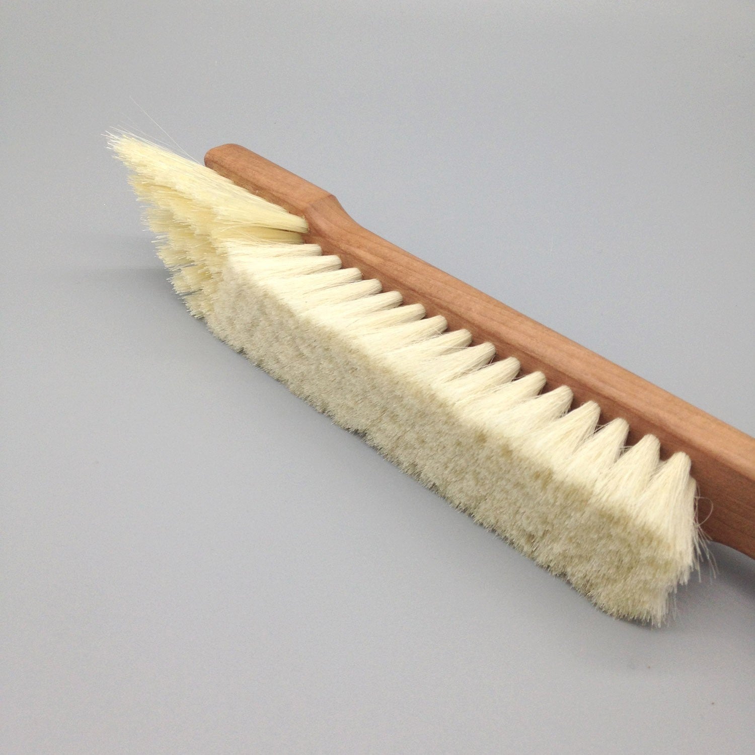 book cleaning brush with natural bristles and timber handle