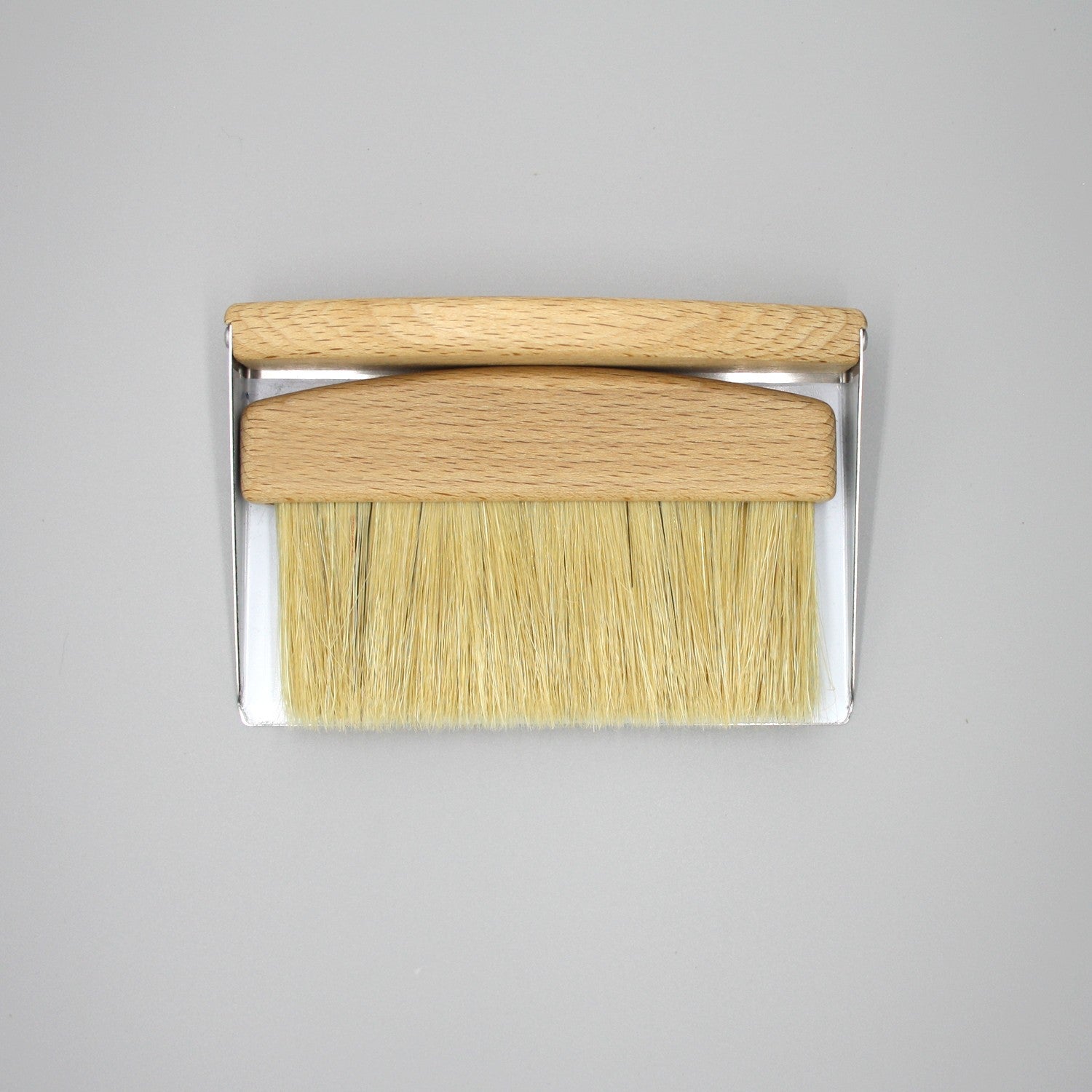 table crumb brush in light oak timber