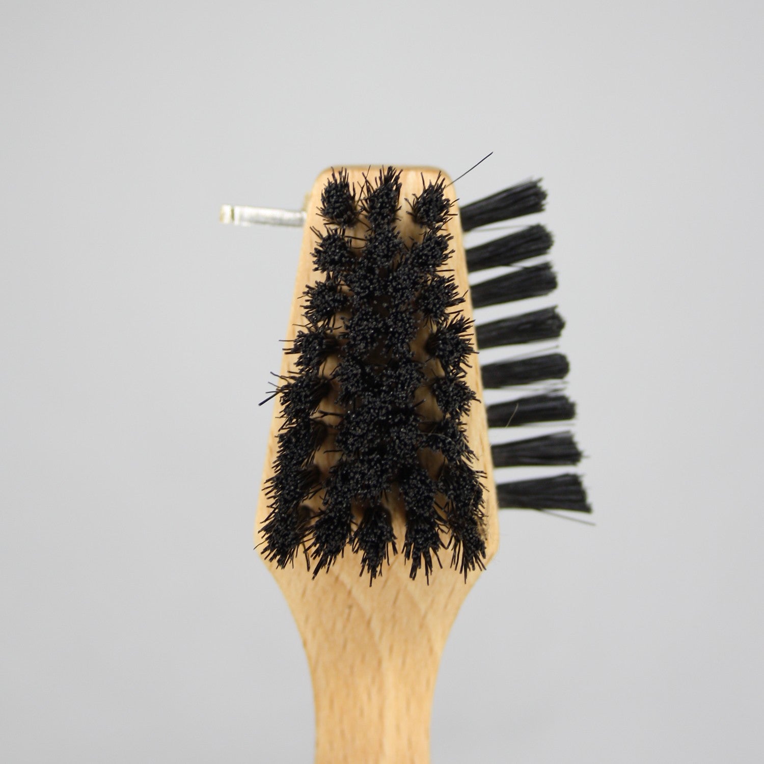 three different cleaning brushes in one to get at those stubborn mucky boot soles