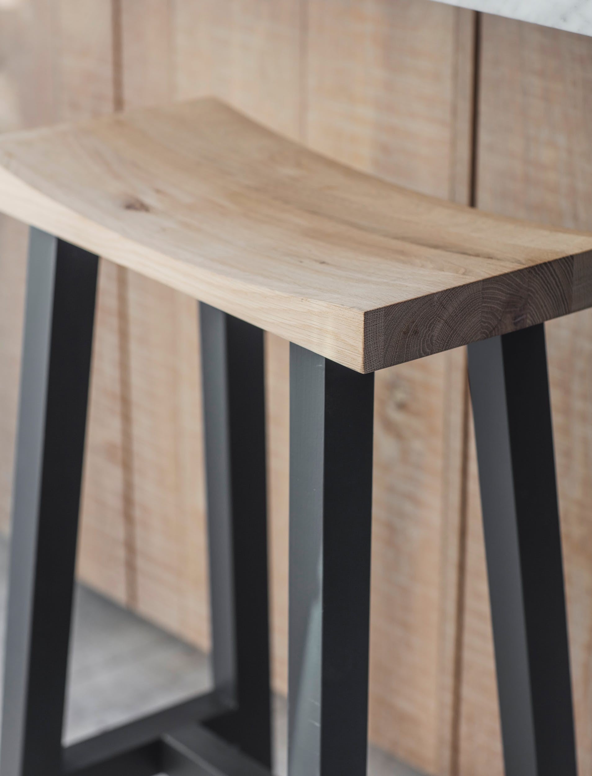 modern bar stool with off black painted legs