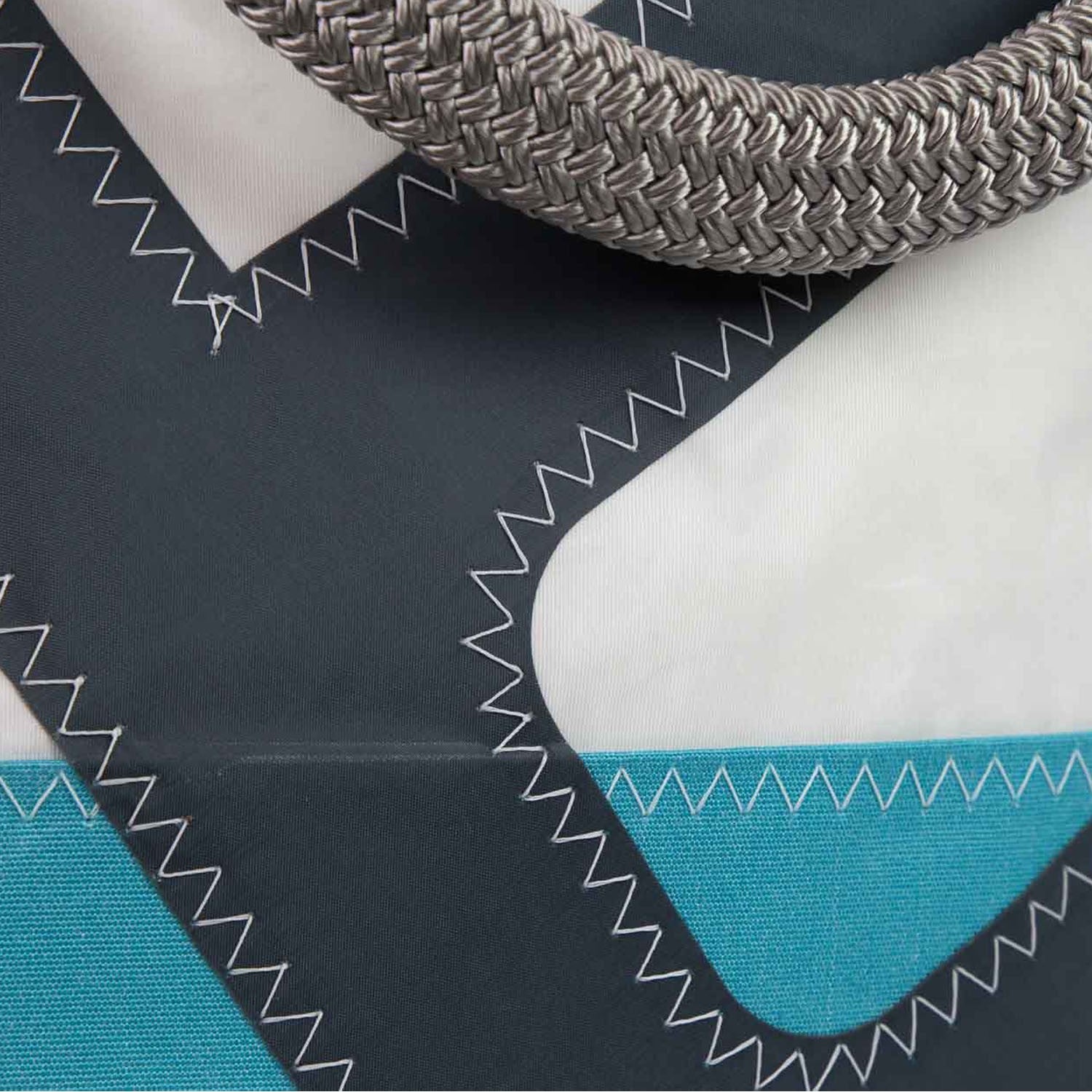 detail of sail bag hand bag in turquoise and navy
