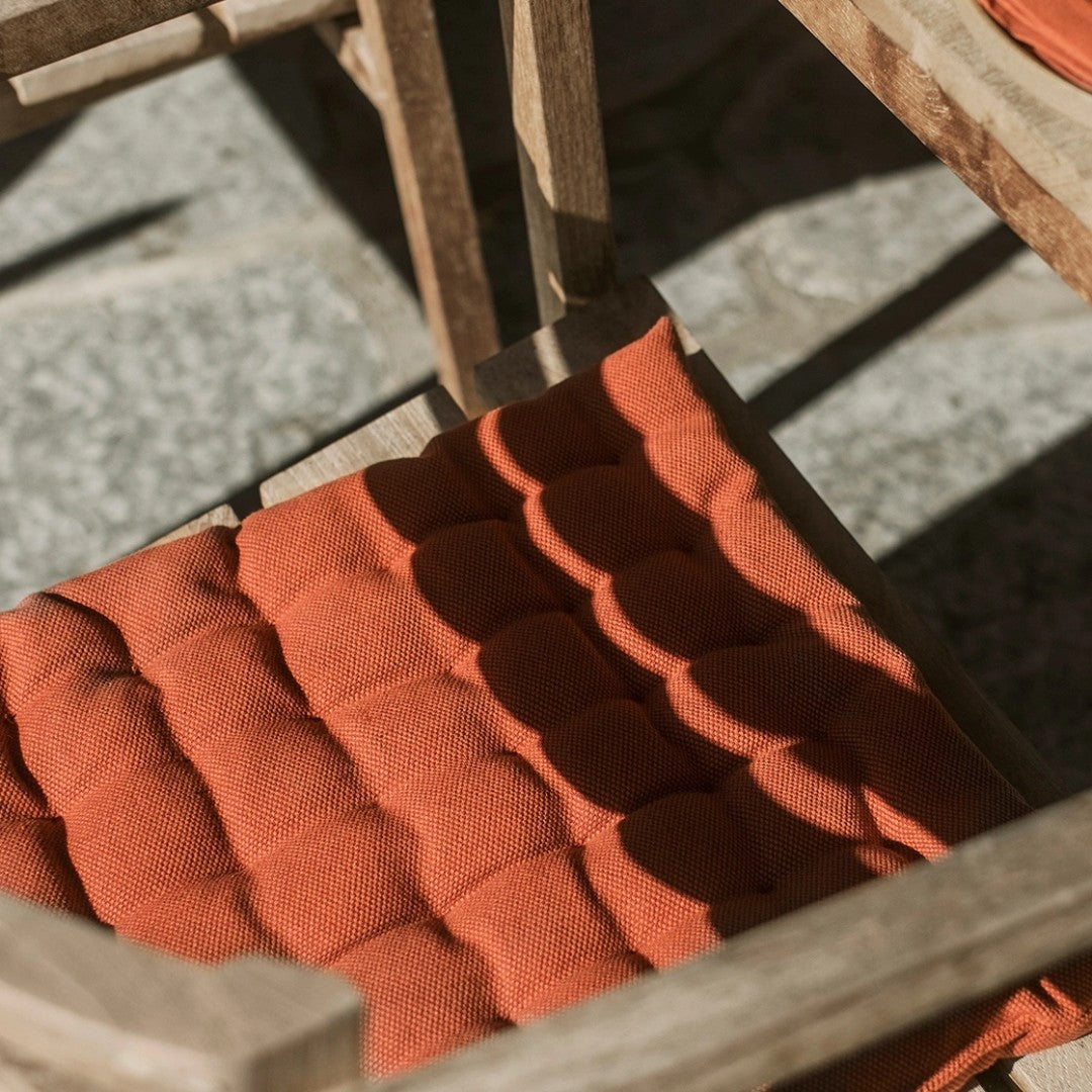 rust orange pepper seat cushion from the blue door
