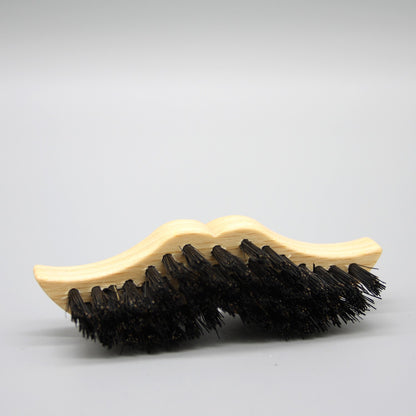 Moustache shaped beard brush 
