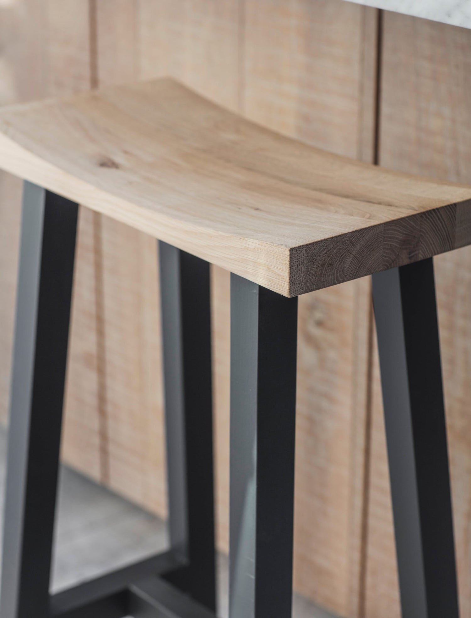 modern bar stool with off black painted legs